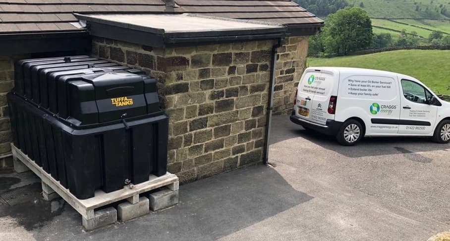 Photo shows a Tuffa tank being installedPhoto shows a Kerosene Oil tank and an installers van
