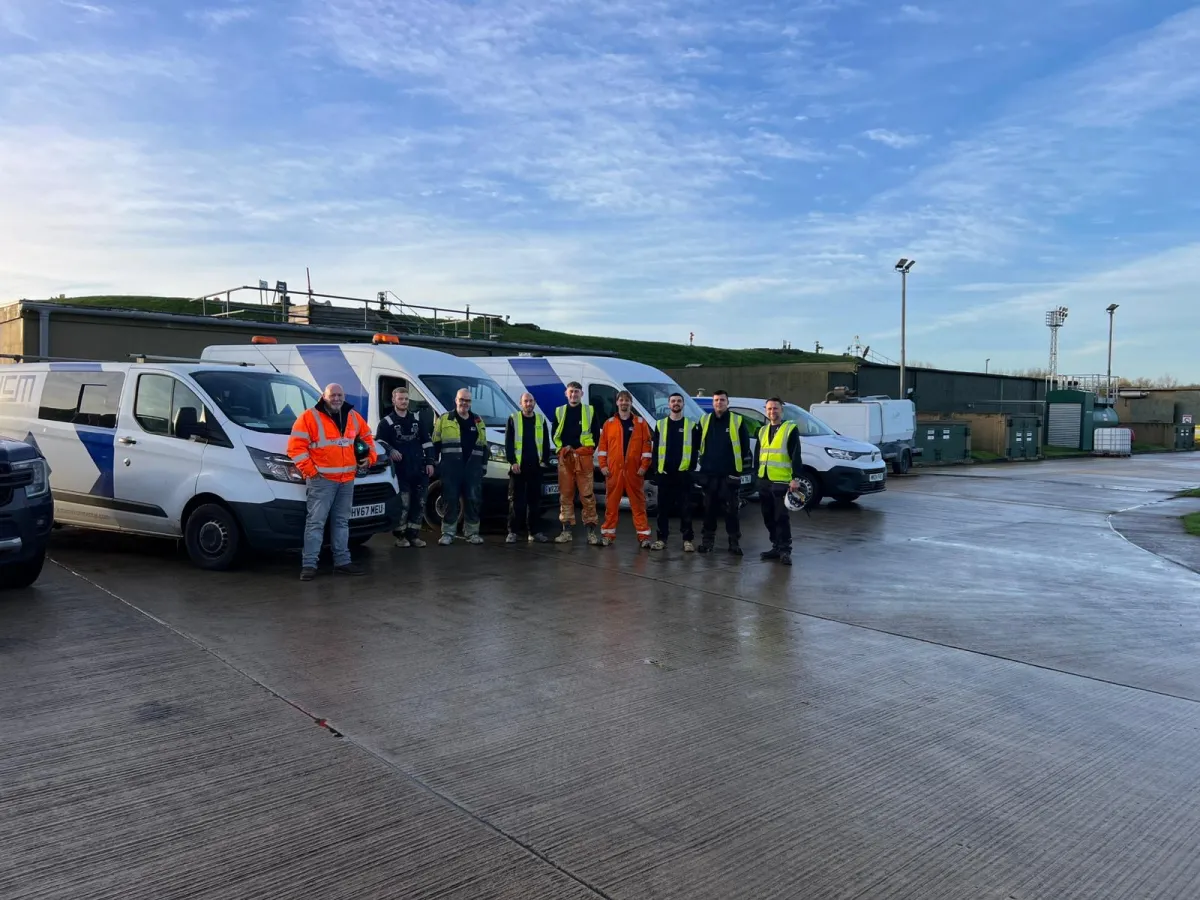 The LCM Environmental team beside their service vans